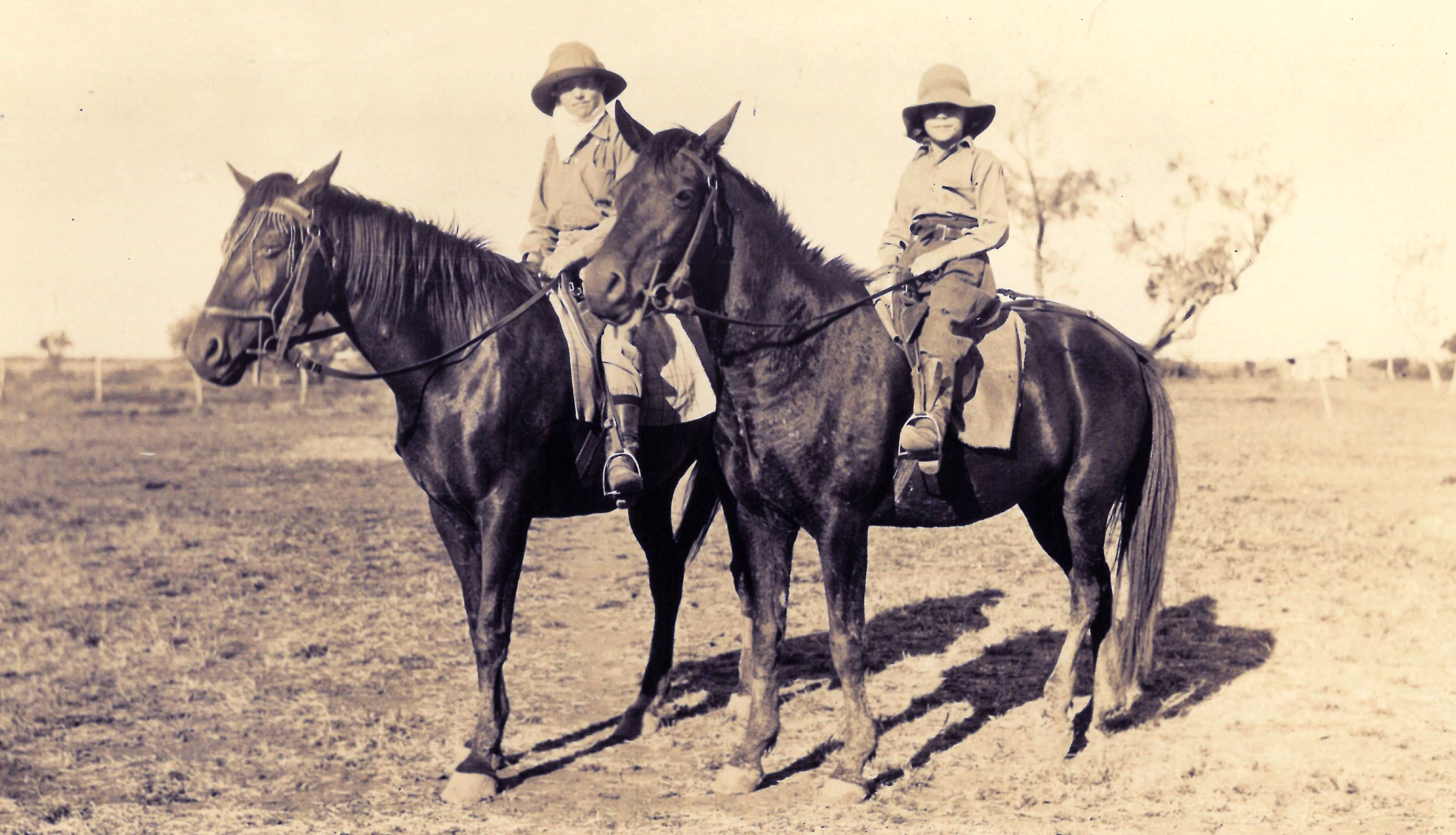 Edie and Dell Farley riding horses at Dalgonally Station, Queensland, 1924 (N172-17). 