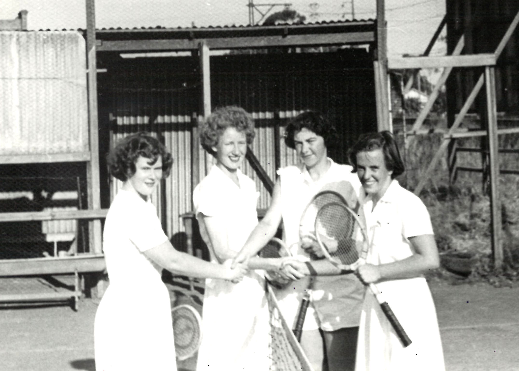 AMP Ladies A Grade Melbourne Office Tennis Team, Melbourne, Victoria, 1951 (N434-1419). Pictured left to right - M. Wiggins, E. Carrick, J. Pooley and V. Alexander.