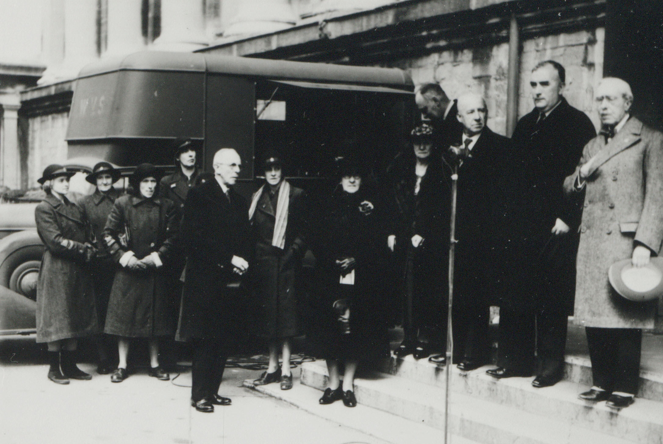 Prime Minister Robert Menzies presenting a mobile kitchen donated by AMP staff to the Women's Voluntary Services, Bristol, England 1940 (N434).