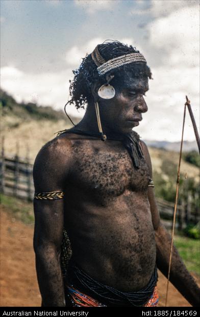 Papua New Guinean man with bow