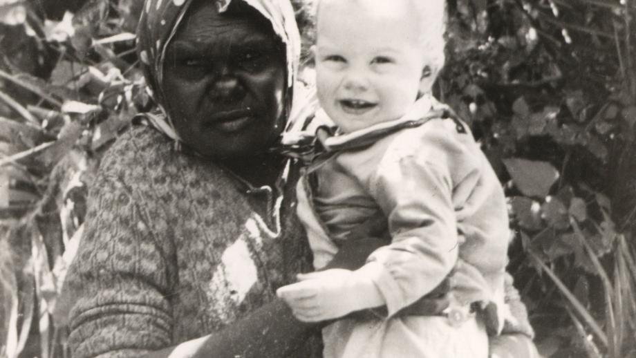 Aboriginal housemaid 'Mabel' holding Roberta Bragg, daughter of the station managers, Avon Downs Station, Northern Territory, c. 1930s (Z241-211).