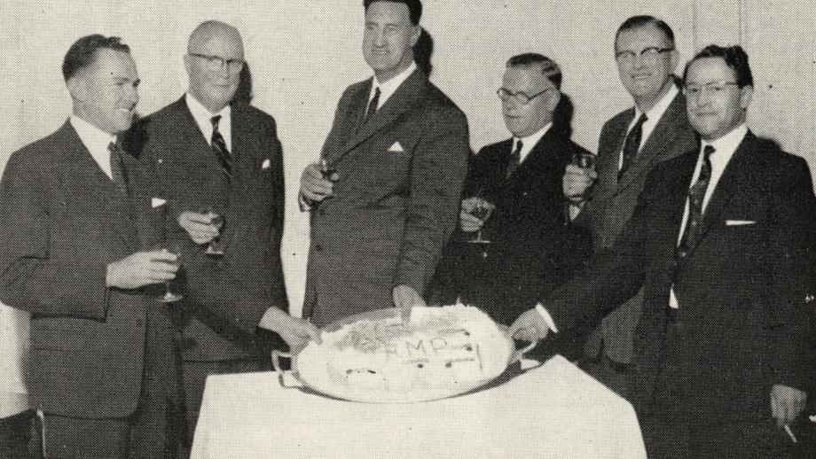 AMP staff and guests from the National Commercial Bank of Scotland attend the opening of AMP's new regional office in Glasgow, Scotland, December 1961 (N434).