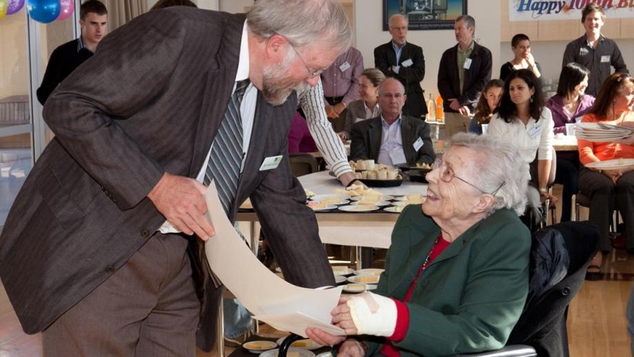 Joan Duffield with Mount Stromlo Observatory Director Harvey Butcher celebrating her 100th birthday, 2010 (Courtesy of ANU RSAA).